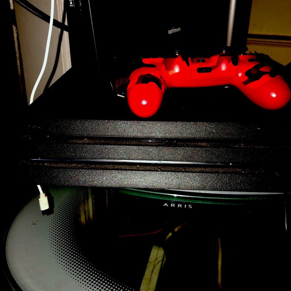 PS4 pro COMES WITH 2 controllers a all black one and a RED Army one